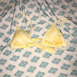 Yellow tie die bathing suit.